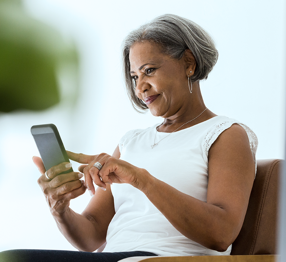 Photo of woman touching smarphone she is reading